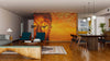 A modern living and dining area features wooden floors, teal and wood furniture, a patterned rug, and a Gold Buddha Wall Mural; an eight-seat dining table sits under spherical pendants with the kitchen in view.