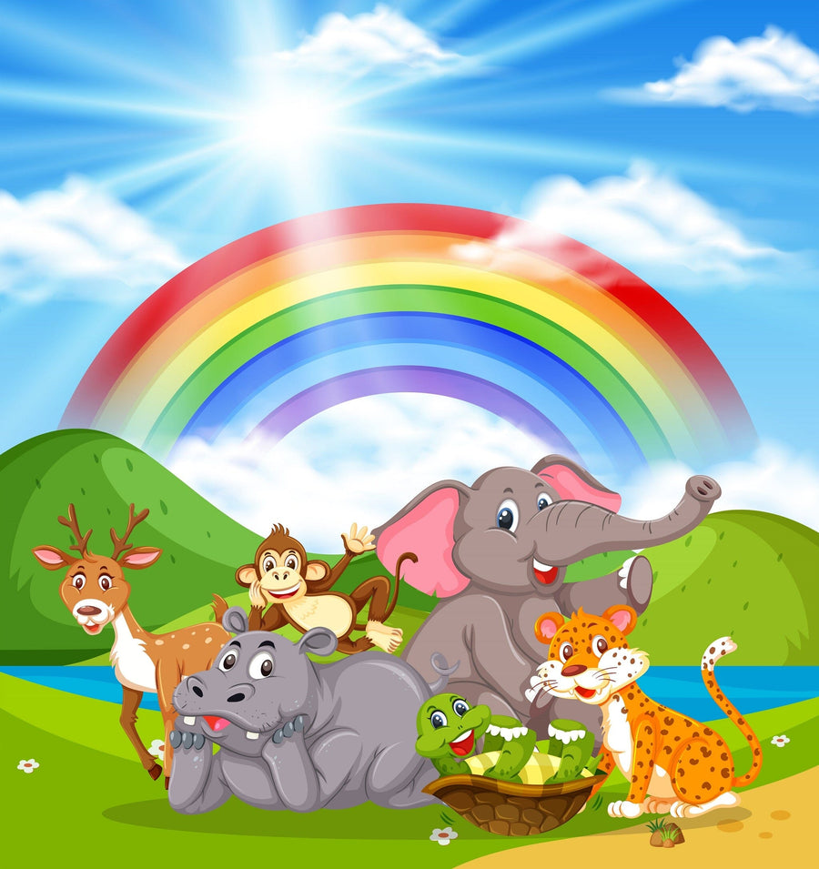 A bright nursery with a crib, rocking horse, and wardrobe features the Happy Animal Valley Wall Mural behind the crib, showing cartoon jungle animals under a rainbow in a sunny green landscape with blue sky and clouds.