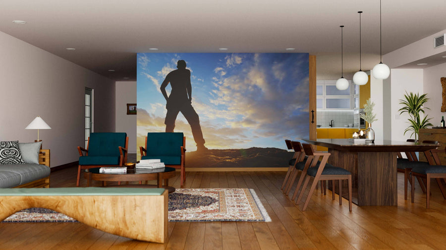 A modern living-dining area features wooden floors, green chairs, a long dining table, and globe pendant lights. The "Embracing the Horizon Wall Mural" adds a striking visual focal point with its sunset silhouette on the central wall.