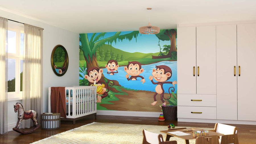 A bright nursery with a crib, white wardrobe, and the Jungle Monkey Mischief Wall Mural showing cartoon monkeys by a jungle river. Sunlight streams in as toys rest on a cozy rug atop the wooden floor.