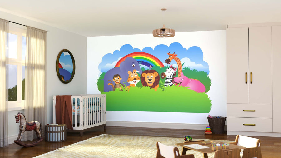 A bright nursery showcases the Jungle Rainbow Friends Wall Mural, featuring cartoon animals—lion, zebra, giraffe, elephant, hippo, monkey, and birds under a rainbow—plus a crib, rocking horse, toys, and sunlight from the window.