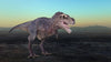 The Dino 2 Wall Mural presents a realistic Tyrannosaurus rex with sharp teeth and textured skin against a flat, barren landscape. Distant hills and a gradient sky from blue to yellow enhance the scene, making it ideal for custom printed murals with its prominent tail adding dramatic flair.