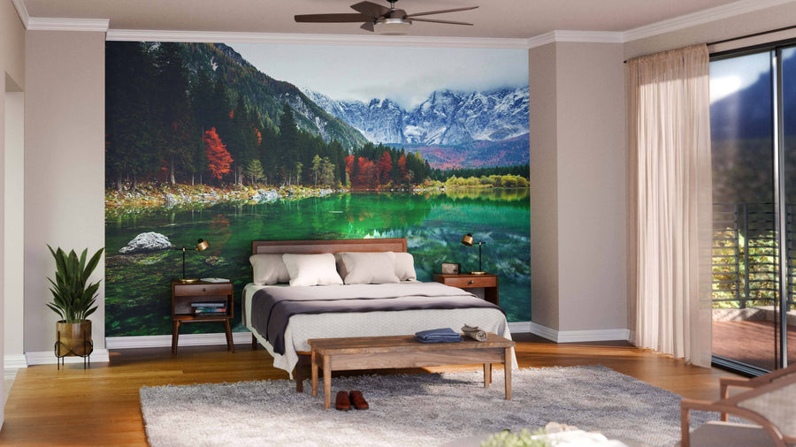 Spacious, modern living-dining area with wood floors, eclectic furniture, and a striking Lake Fusine and Val Di Funes Wall Mural. Pendant lights hang above a dark dining table in this bright, cozy, and stylishly decorated space.