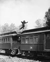 Leaping Across the Train Wall Mural Peel and stick Wall Mural photo Color Original Custom Size