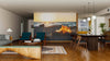 A modern living-dining room with wood floors and mid-century furniture features a large Beach Bonfire Wall Mural on the back wall, adding warmth and depth to the cozy space. Pendant lights hang above the neatly arranged dining table.