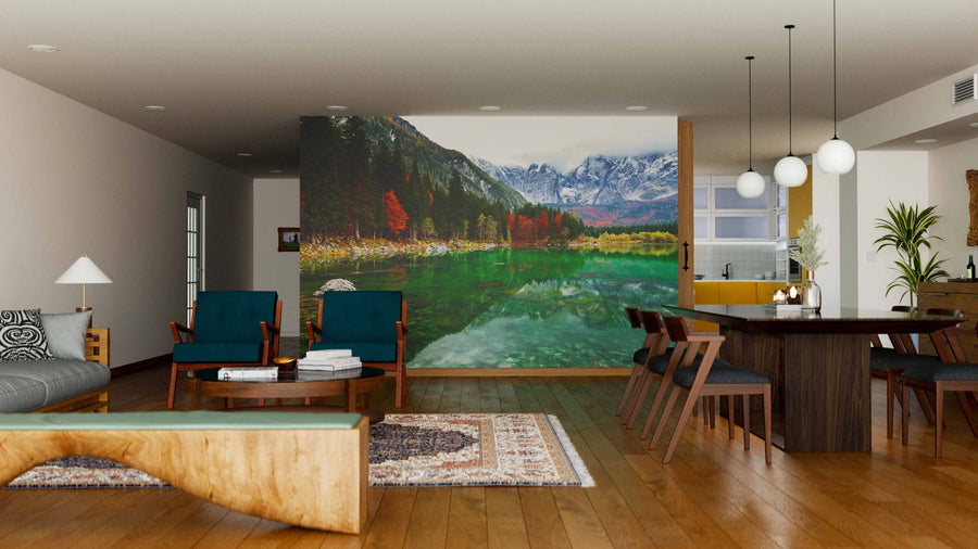 Spacious, modern living-dining area with wood floors, eclectic furniture, and a striking Lake Fusine and Val Di Funes Wall Mural. Pendant lights hang above a dark dining table in this bright, cozy, and stylishly decorated space.
