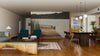 A modern living-dining room with wood floors, teal chairs, a sectional sofa, and the Lake Quay Wall Mural as an accent wall. The dining area has a dark wood table, six chairs, pendant lights, and a kitchen in the background.