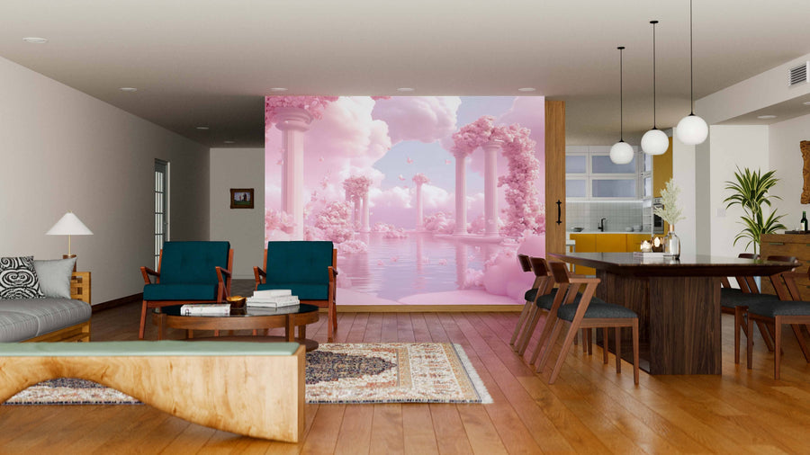 A modern living-dining room with wood furniture and cozy seating features the Pink Haven Wall Mural—a dreamy peel and stick mural with pink landscapes, classical columns, clouds, trees, and a pool—adding a surreal touch to the neutral decor.