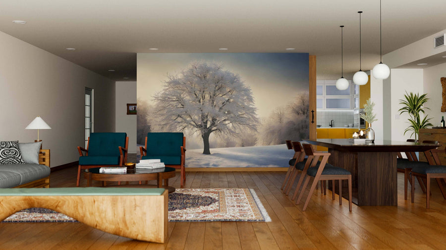 A cozy, modern living-dining room with wooden floors and pendant lights features the Snow-Covered Tree at Sunset Wall Mural, adding a serene, natural touch to the stylish space with its wintry landscape of bare trees.