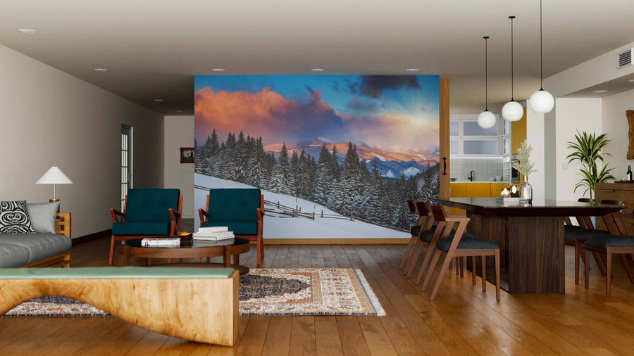 A modern open living-dining area features wood floors, mid-century furniture, and the “Snowy Rolling Hills Wall Mural,” which brings color and warmth to the neutral decor. Spherical pendant lights are suspended above the dining table.