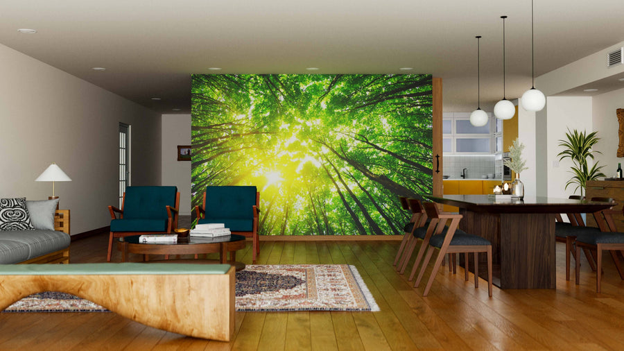 Modern open-plan living and dining room with wooden floors, mid-century furniture, and the Spring Forest Through the Treetops Wall Mural—a peel and stick mural of sunlit trees, creating a bright, nature-inspired focal point.