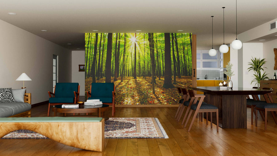 A modern open-plan living and dining area features wooden floors, mid-century furniture, and a Sun Beams Autumn Forest Wall Mural for a bright, natural feel. Contemporary lights hang above the dining table, with the kitchen visible in the background.