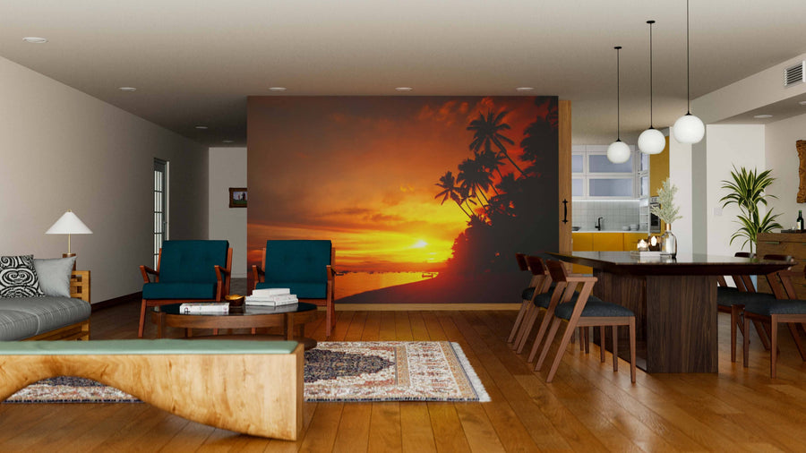 Open-plan living and dining area with wooden floors, mid-century modern furniture, lounge space, and dining table. The Sunset Boats Wall Mural brings warmth and an inviting atmosphere with its vibrant tropical sunset scene.