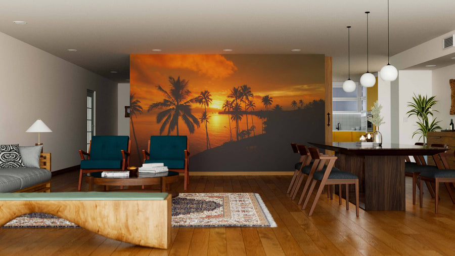 A modern living-dining room with wooden floors, teal chairs, a patterned rug, and a unique coffee table. The dining area is brightened by the Tall Palm Trees Wall Mural, adding warmth and a tropical atmosphere to the space.