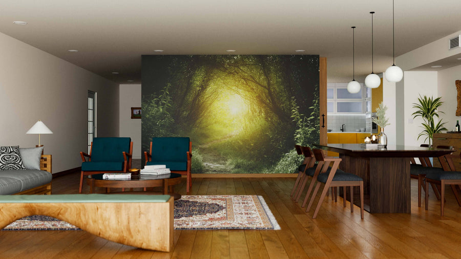 Modern open-concept living and dining room with wood floors, mid-century furniture, and the Way in Deep Forest Path Wall Mural for a serene vibe. Round lights hang above the dark dining table; kitchen sits in the background.