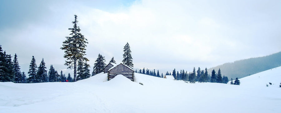 Small wooden house on the hill of mountains in winter – Peel and Stick Wall Murals