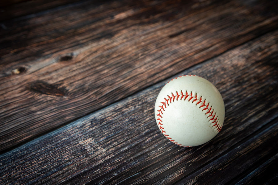 Baseball on Rustic Wooden Table Wall Mural
