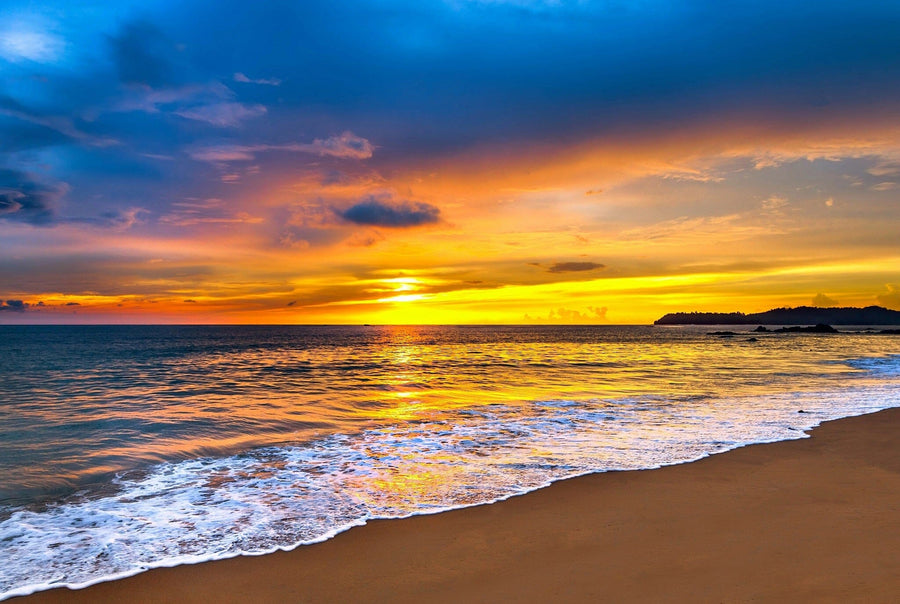 A vibrant sunset over the deep blue sea – Peel and Stick Wall Murals