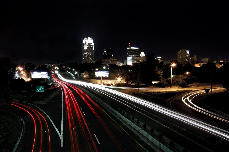 Downtown Skyline and Passing Cars Wall Mural