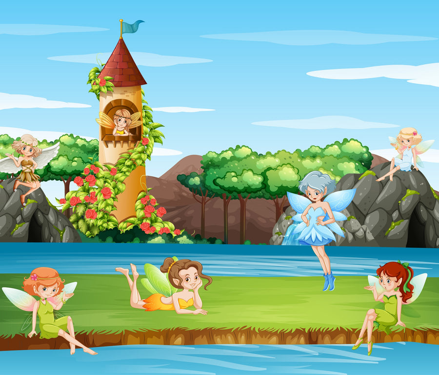 Five fairies in bright dresses relax on grass by a river—two lie down, one stands, and two sit on rocks. Behind them rises a tall flower-covered tower. The Nursery 16 Wall Mural brings this magical scene to any room.