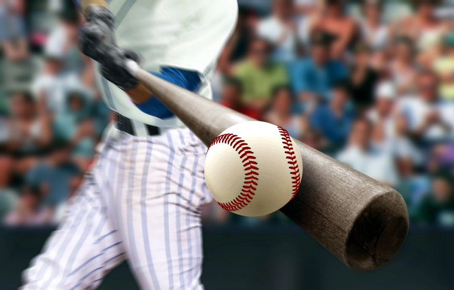 Capture the thrill of the game with Baseball 3 Wall Mural—a close-up of a baseball hit by a wooden bat, featuring a batter in white pinstripes and a dynamic crowd. Ideal for canvas textured removable wall murals to energize your space.