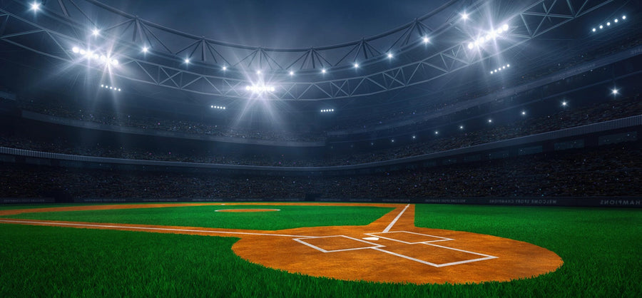 Transform your space with the Lit Baseball Stadium Wall Mural—a peel and stick, adhesive-backed mural featuring a brightly lit, empty baseball stadium at night viewed from behind home plate. Easy to install and remove.