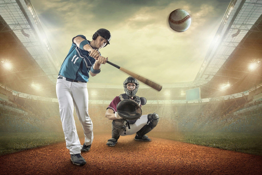 The Baseball 6 Wall Mural features a player in a blue jersey swinging at a pitch under stadium lights, with a catcher behind home plate—a dynamic scene that brings lively stadium energy to your space.