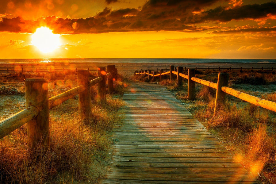 wooden path stretching towards the sea during sunset – Peel and Stick Wall Murals