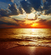 Beautiful sunset over sea with clouds creating a picturesque scene – Peel and Stick Wall Murals