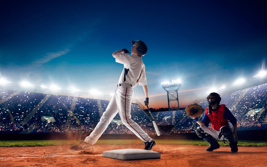 Swing for the Fences Wall Mural captures a baseball player swinging a bat in a white uniform, with matte canvas detail and stadium lights, creating an action-packed peel and stick mural for any room.