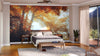 A modern bedroom features the Misty Forest in Autumn Wall Mural above a wooden bed, with light walls, matching nightstands, a gray rug, hardwood floors, and sliding glass doors with sheer curtains creating an inviting atmosphere.