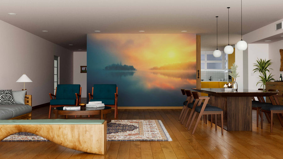 A modern living and dining area with wooden floors, teal chairs, a gray sofa, and the "Misty Morning in Lake Wall Mural" as a stunning centerpiece. Pendant lights illuminate the six-seater dining table while rugs and artistic accents complete the cozy space.
