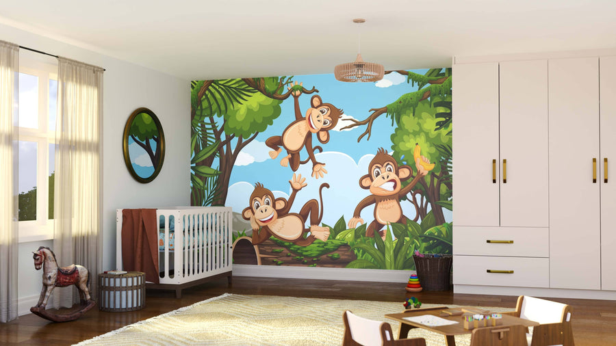 A bright nursery features the Monkey Jungle Fun Wall Mural with three playful monkeys in a jungle scene. Peel and stick mural, crib, toys, rocking horse, and sheer curtains create a cheerful, light-filled atmosphere.