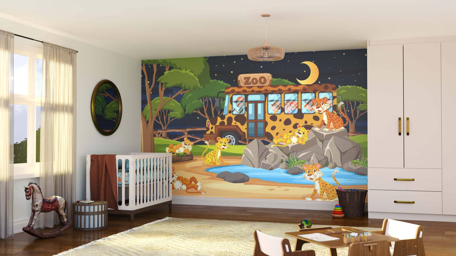 A nursery showcases the Night Zoo Wall Mural, displaying cartoon cheetahs at a nighttime zoo with a crescent moon, rocks, trees, and a pond. The room is furnished with a crib, toys, baskets, rocking horse, rug, and curtained windows.