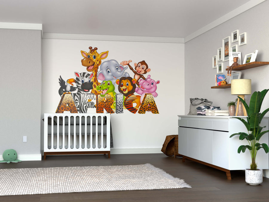 A nursery with a white crib and dresser gets a modern touch from the African Wildlife Wall Mural above the crib, where cartoon jungle animals spell out “NIA.” This removable wallpaper makes it easy to keep the room tidy and refresh as your child grows.