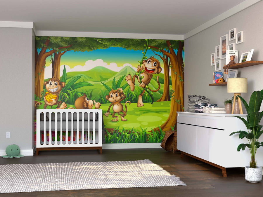 A nursery with wooden floors, a white crib and dresser features the cheerful Banana Mischief Wall Mural with playful cartoon monkeys and green trees. A plant, toys, and decorated shelves complete the cozy space.