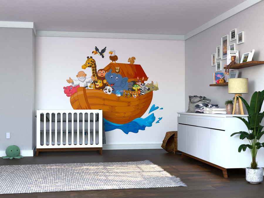 A nursery with a crib, dresser, plants, and toys features the Barnyard Buddies Wall Mural—colorful and animated animals on an ark with blue waves. The room has wood floors, light gray walls, and playful removable wallpaper accents.