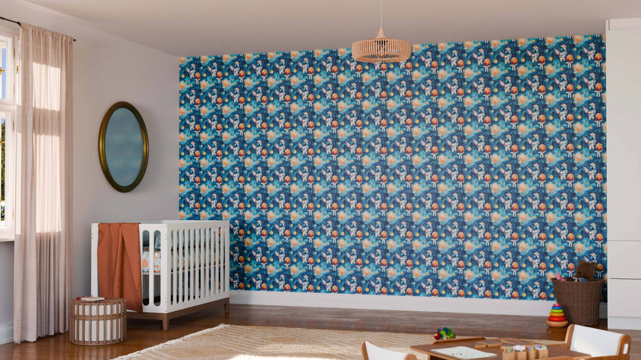 A nursery with a white crib, a round mirror, and an accent wall featuring the Cosmic Adventure Wall Mural with playful animal patterns on a blue background. The room includes sheer-curtained windows, a woven rug, toys, and wooden furniture.