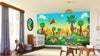 A bright nursery with a large window, crib, and rocking horse. The wall features the Cute Wildlife Animals Wall Mural, displaying jungle animals against a sunset sky. Blocks and toys are scattered across the floor.