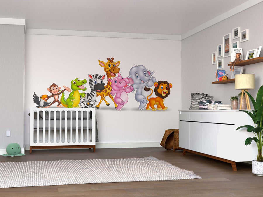 A bright nursery features a white crib, animal decals, a dresser, houseplants, rug, and floating shelves for toys and photos. The Dancing Safari Friends Wall Mural adds playful charm to the light walls and wooden flooring.