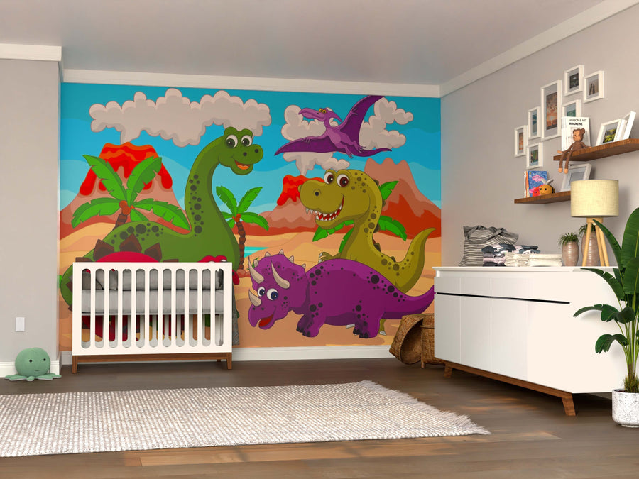 A nursery showcases the Dino Buddies Wall Mural with smiling dinosaurs behind a white crib, plus a modern white dresser, wooden shelves with toys and books, a green plant, and a soft rug on wood flooring.