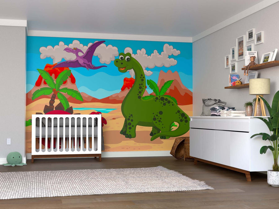 A nursery with a white crib and dresser features the Dino Day in Lava Land Wall Mural, a peel and stick design with a cartoon green dinosaur and purple pterodactyl. Wood floors, plants, and decor-filled shelves complete the cozy space.