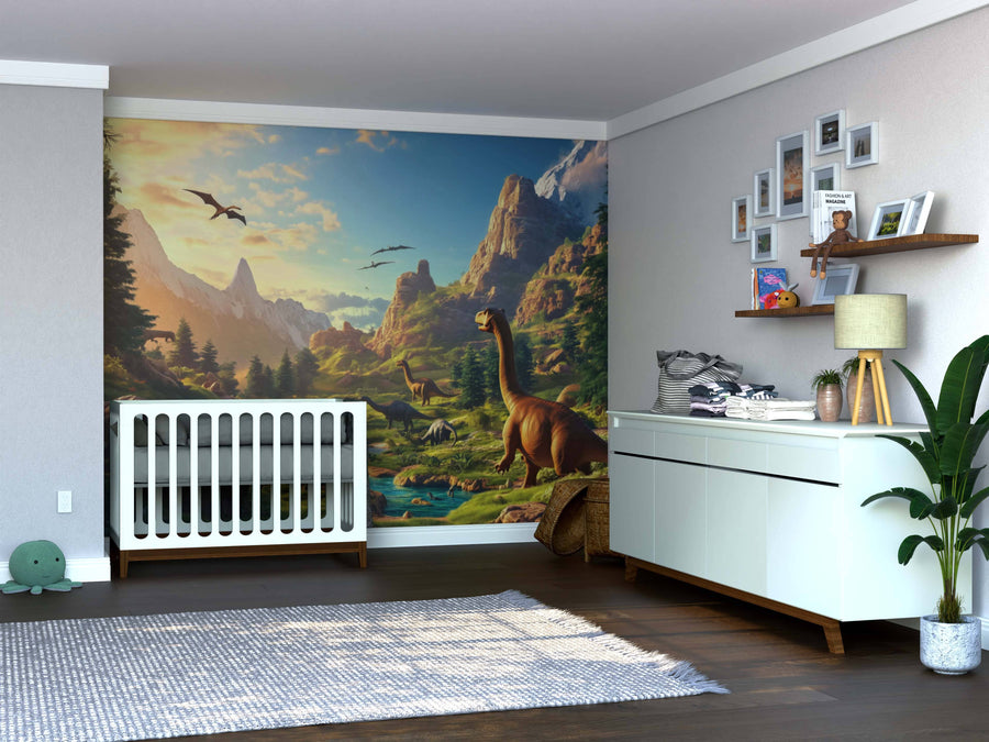 A nursery with a white crib, dresser, and rug features the Dinosaur Kingdom Wall Mural showcasing a vibrant prehistoric scene. Shelves hold decor, framed photos, a plant, and a turtle plush toy for cozy finishing touches.
