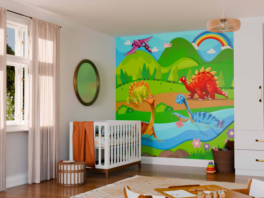 A bright nursery features a crib and the Dinosaur Paradise Wall Mural, showcasing cartoon dinosaurs, hills, a rainbow, and blue river. The room includes a round mirror, curtained window, woven lamp, changing table, and toy-filled storage baskets.