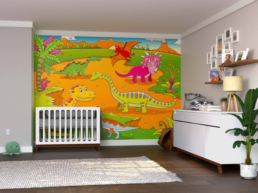 A bright nursery features the Dino Playland Wall Mural with colorful cartoon dinosaurs on an orange backdrop. A white crib, dresser, plant, and wooden floor complete the cheerful look. This peel and stick mural adds playful charm to any room.