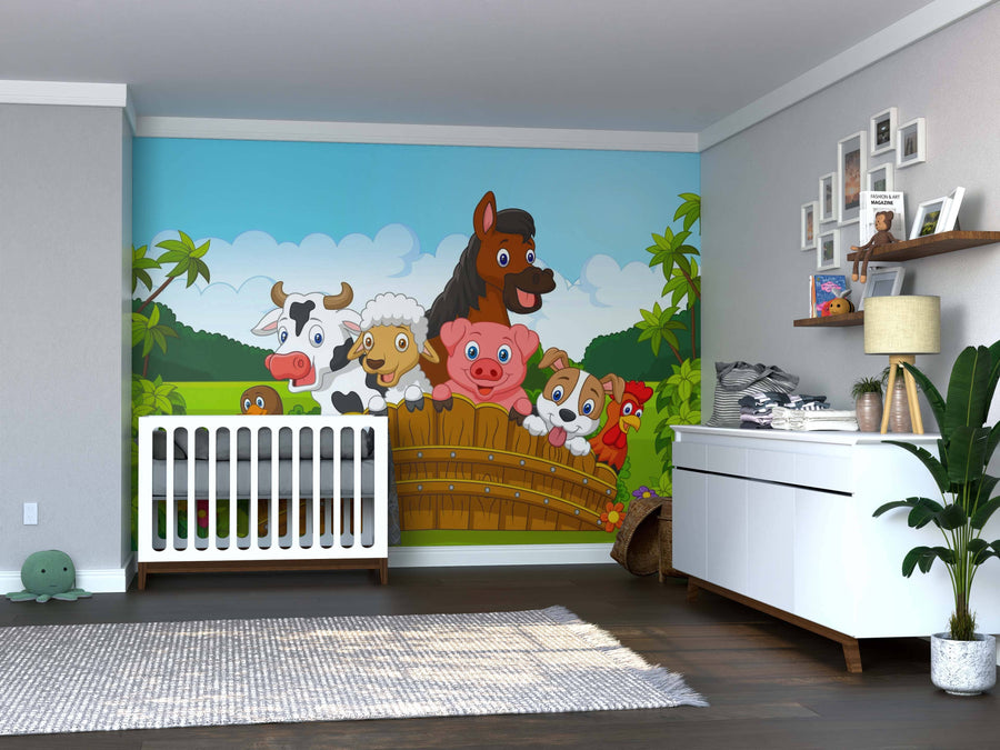 A nursery with a white crib and dresser features the Farm Friends Wall Mural—cartoon farm animals behind a wooden fence with green hills and blue sky. Décor includes plants and framed photos.