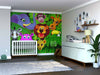 A nursery with a white crib and dresser features the Group of Wild Animals Wall Mural—colorful cartoon jungle animals amid green leaves. Toys, a plant, and photos decorate this cozy room, perfect for custom printed murals or removable wallpaper.