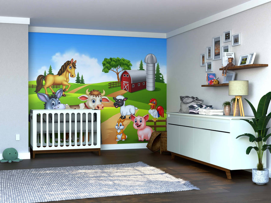 A nursery with a crib and dresser features the Happy Farm Animals Wall Mural, showing cartoon animals by a red barn and silo. Wooden floors, a rug, houseplants, and framed photos on a shelf complete the cozy look.