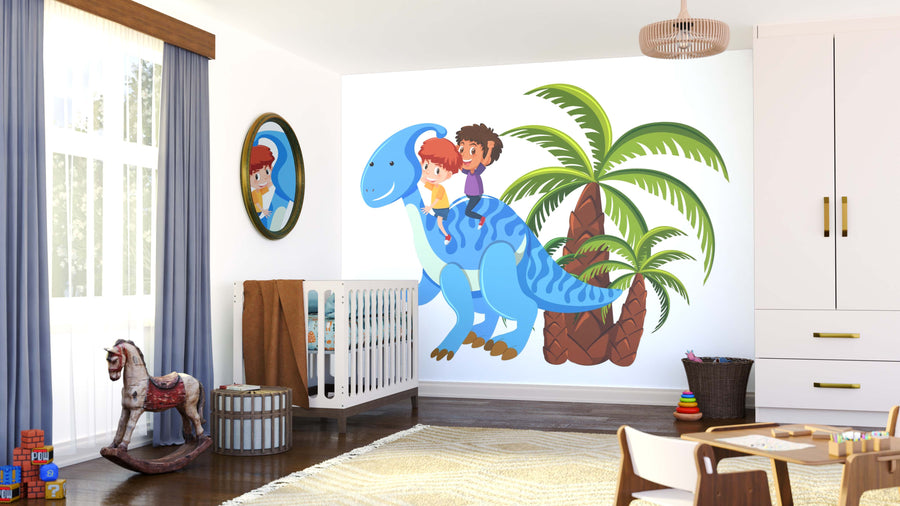 A bright children’s room features a crib, rocking horse, toys, and a Kids Riding Dino Wall Mural showing two kids on a blue dinosaur by palm trees. Sunlight pours through big windows with blue curtains, while a mirror reflects the mural and crib.