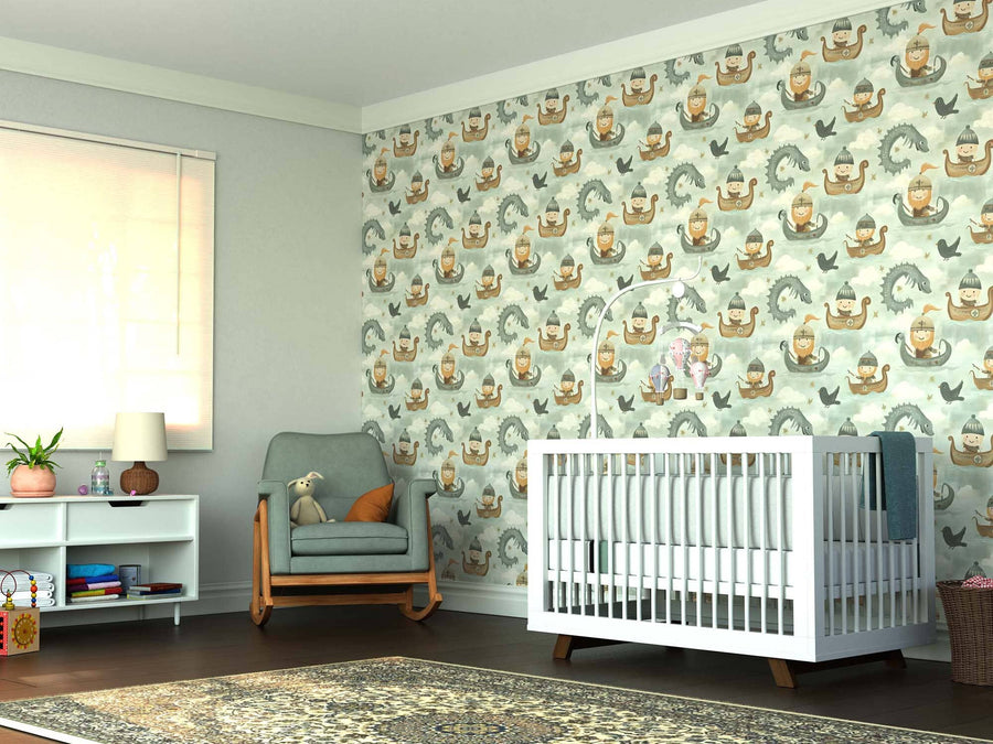 A cozy nursery features a white crib, green armchair with plush toy, small bookshelf, and playful neutral-toned Little Norse Adventurers Wall Mural on the back wall. A patterned rug covers the wooden floor by the window with its blind.